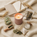 Self-Care Kit flatlay with candle, bath salts, journal, herbal tea, face mask, and dried flowers